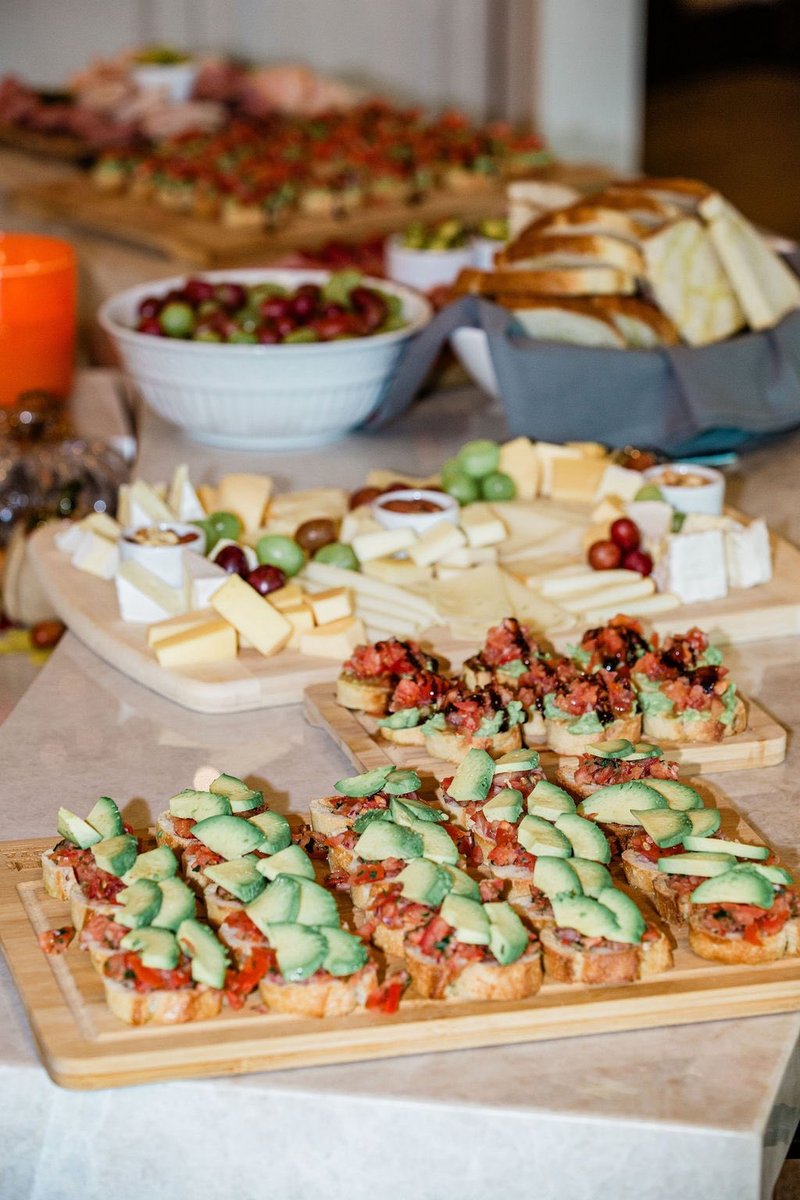 A curated event spread of artisan crostini and cheese boards